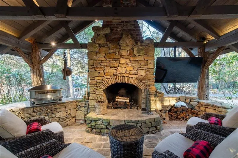 Beautiful outdoor fireplace in log cabin