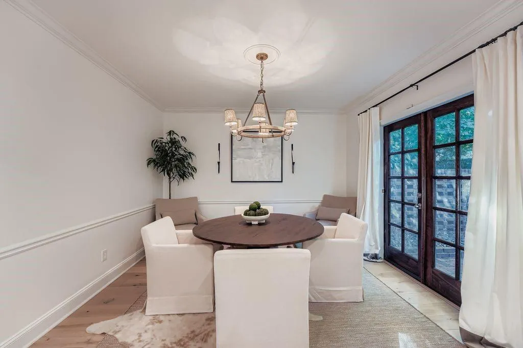 Dedicated dining room featuring french doors to the patio, and a chandelier Dedicated dining room featuring french doors to the patio, and a chandelier