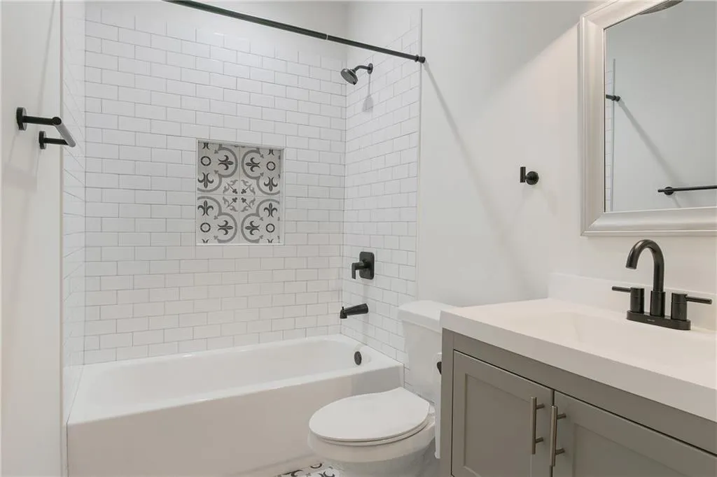 Bathroom featuring vanity and shower / tub combination