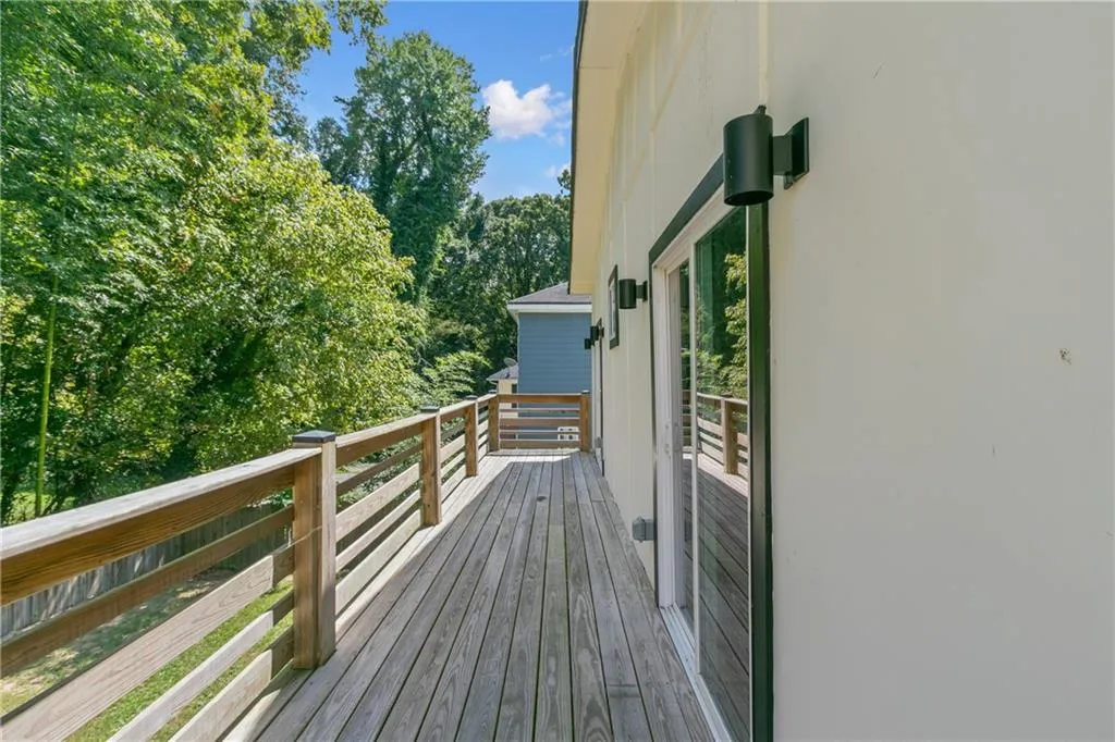 Deck featuring view of scattered trees