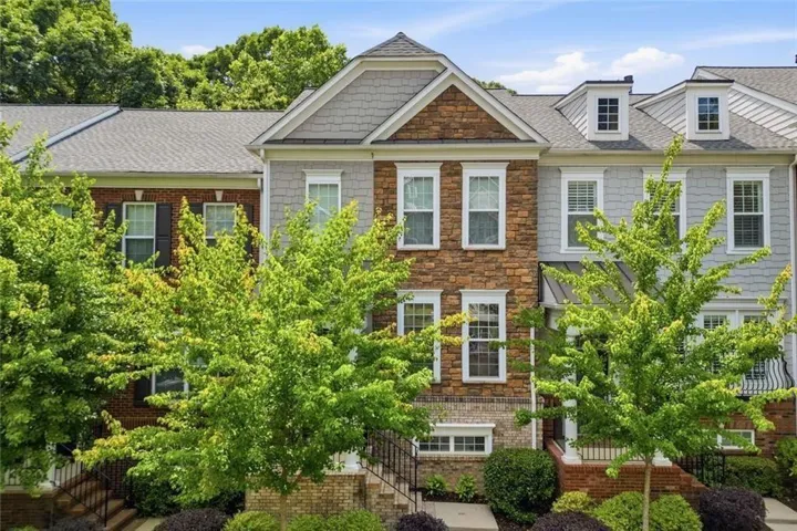 Beautifully crafted with a sophisticated mix of shingle, brick, and stone finishes.