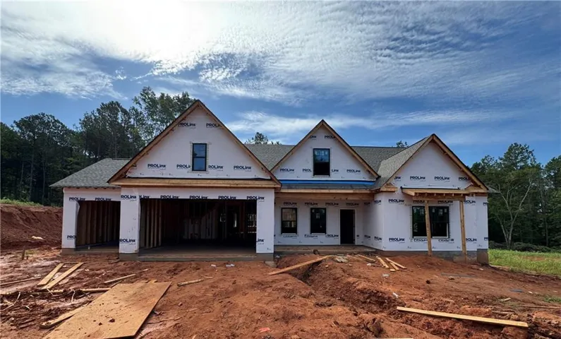 New construction home featuring a multi-gable architectural design with peaked rooflines and dormers