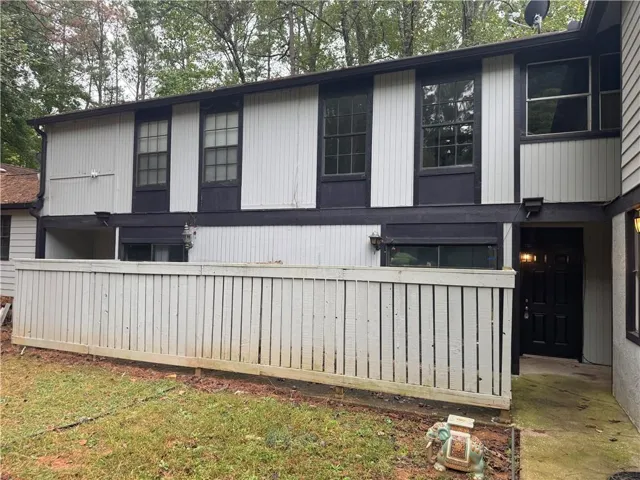 Two-story exterior with vertical siding and contrasting trim