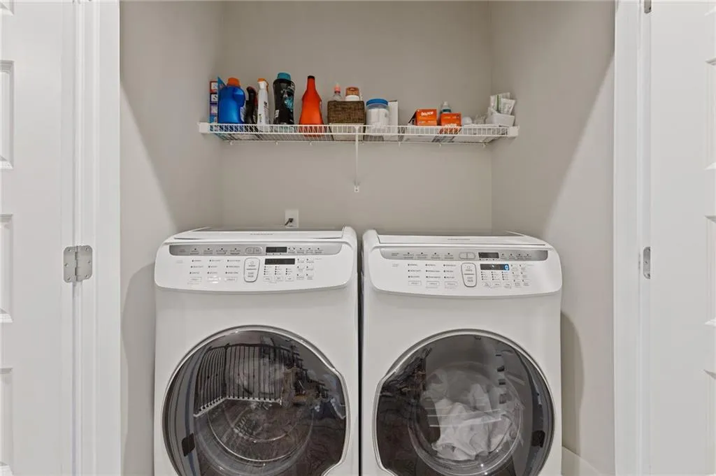 Laundry area featuring separate washer and dryer
