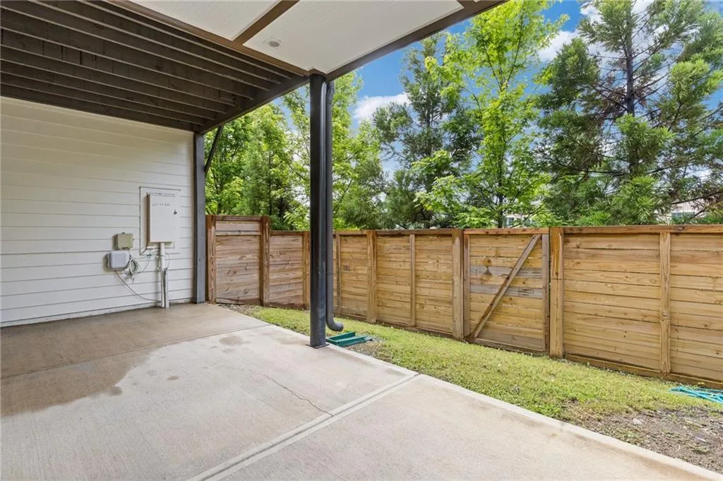 Fenced backyard featuring a patio