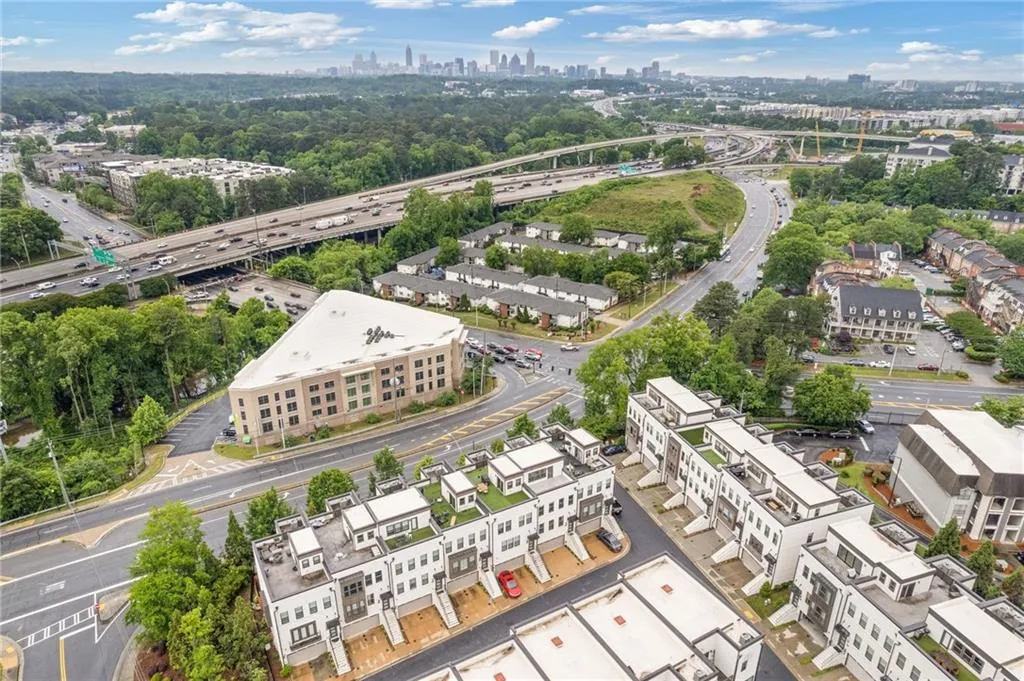 Drone / aerial view of a highway and city skyline
