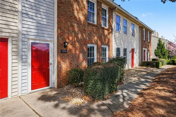 Doorway to property with brick siding