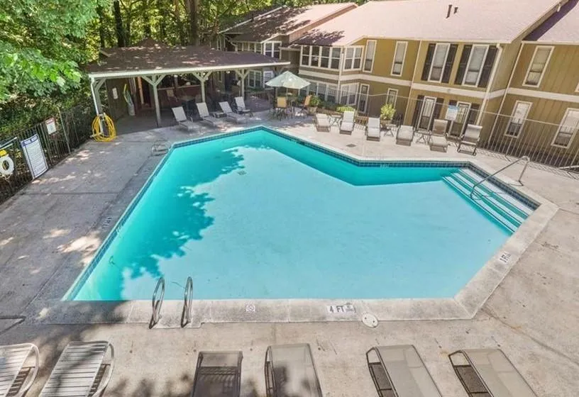 View of swimming pool featuring a gazebo and a patio area