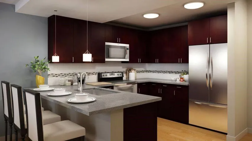 Kitchen with backsplash, stainless steel appliances, sink, light hardwood / wood-style flooring, and pendant lighting