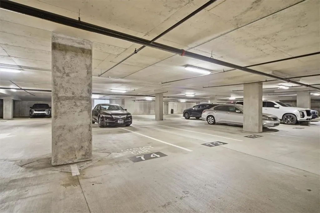Garage featuring a parking garage