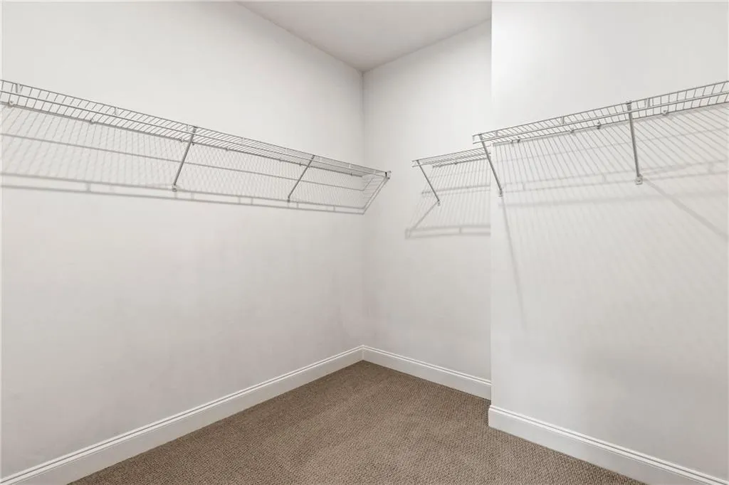 Owner's Suite oversized Walk-in closet. Pictures are of model home
