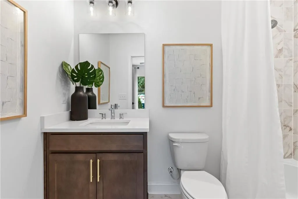 Ground floor full bathroom attached to the bedroom. Pictures are of model home