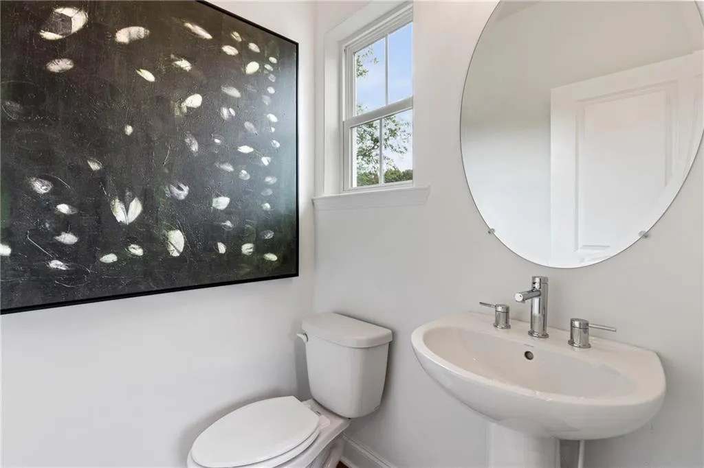 Half bathroom on main living floor. Pictures are of model home