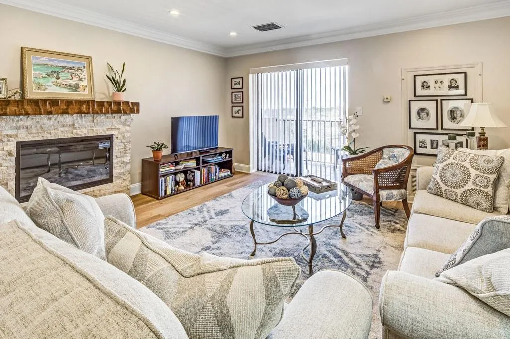 Fireplace & views of the pool and Sandy Springs