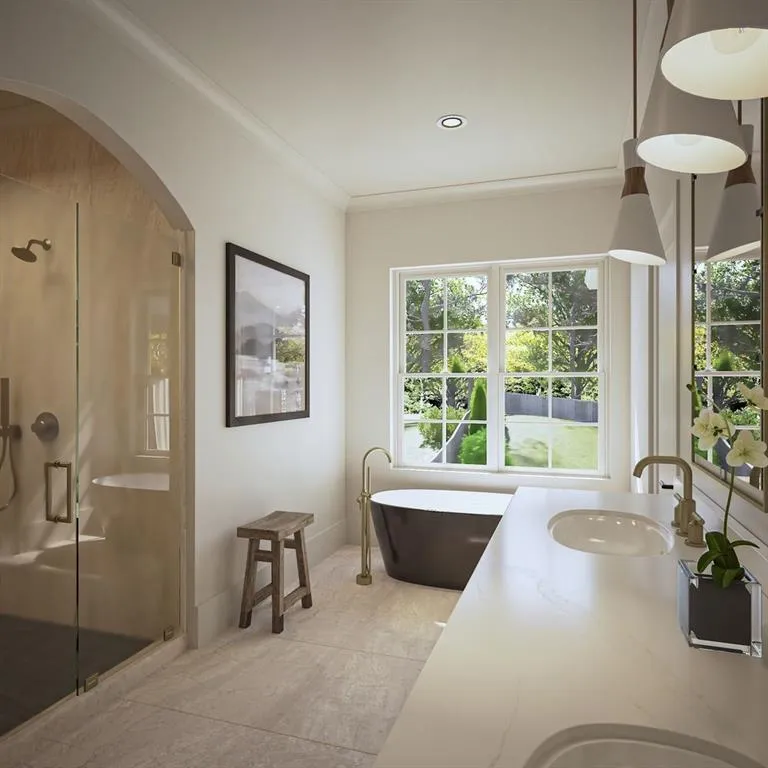 Bathroom with a shower stall, vanity, a freestanding bath, and crown molding