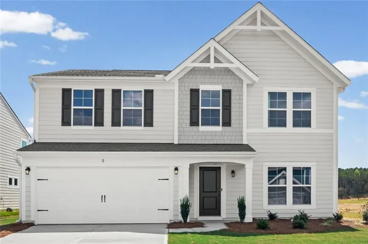 Two-story residence featuring light gray siding with dark shutters, an attached two-car garage, and a covered entry
