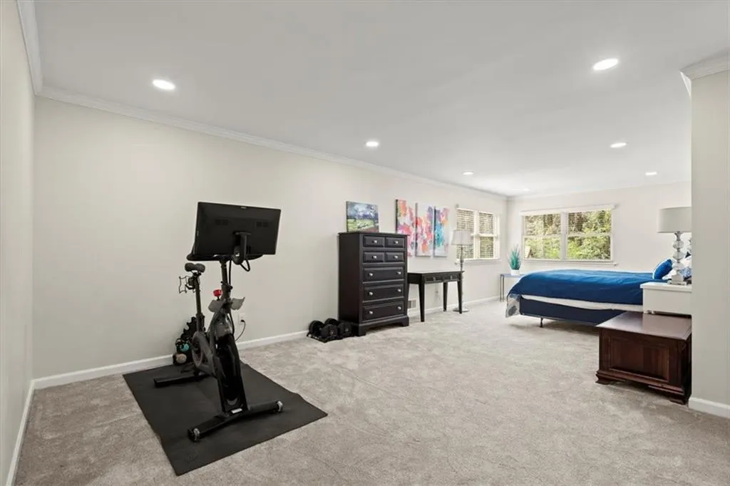 Bedroom #3 on mail level and can add a flex space as you see here with a home fitness area.