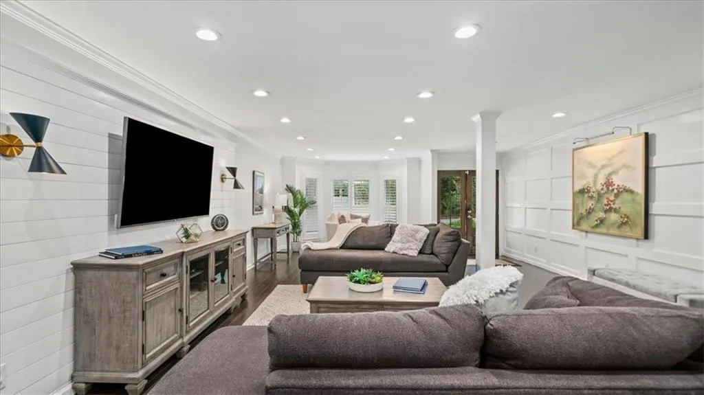 Family Room features a decorative and textured wall adding dimension to this perfect entertaining spot.