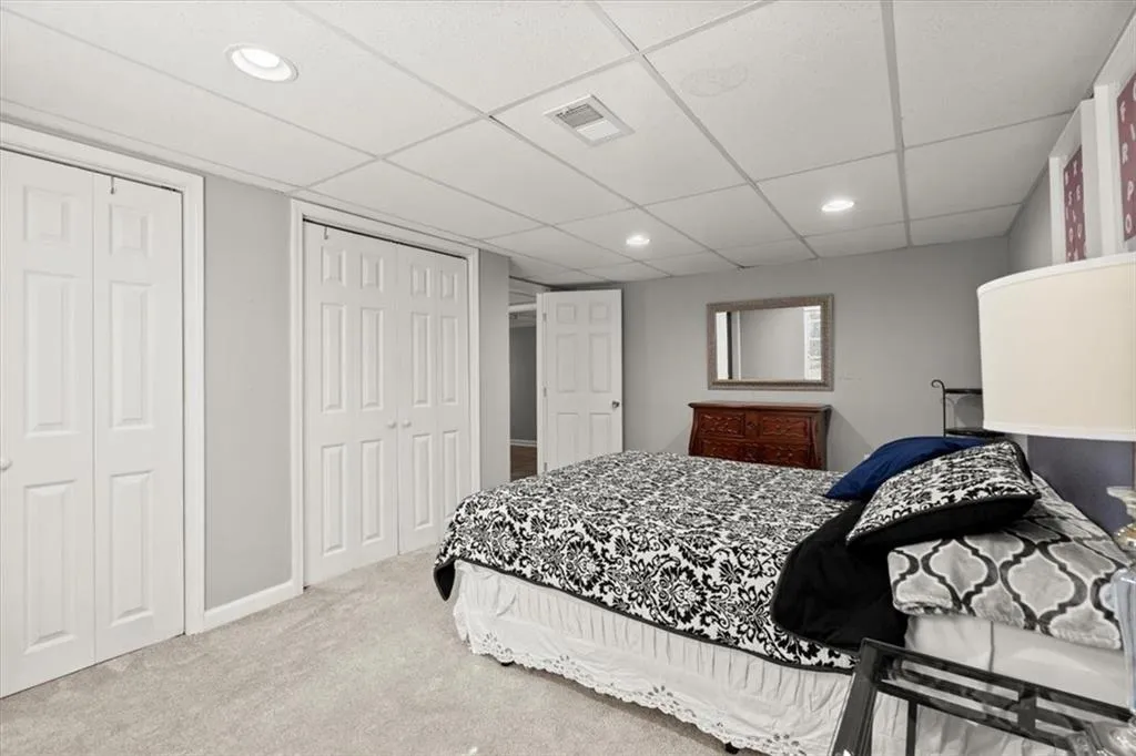 Bedroom #5 on terrace or basement level featuring two closets.
