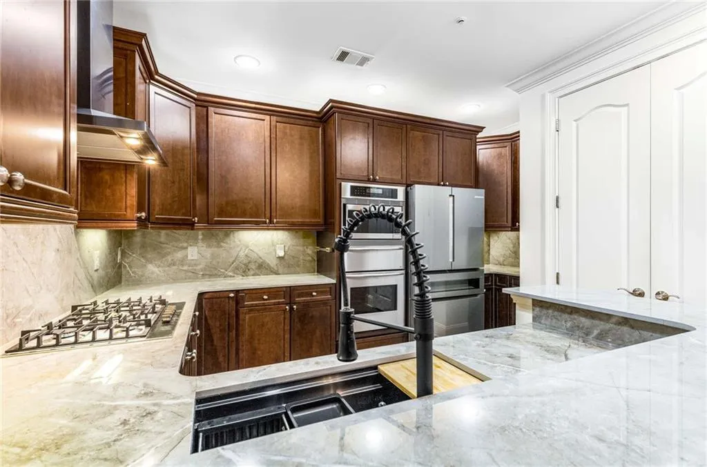 The Kitchen with upgraded appliances is fabulous!  The sink and faucet are new as is the Bosch 5-burner gas cooktop and chimney exhaust; The Thermador 3 unit cooking system has a microwave, warming drawer and convection oven; the Bosch refrigerator is also included with your purchase!  This is truly a dream kitchen!