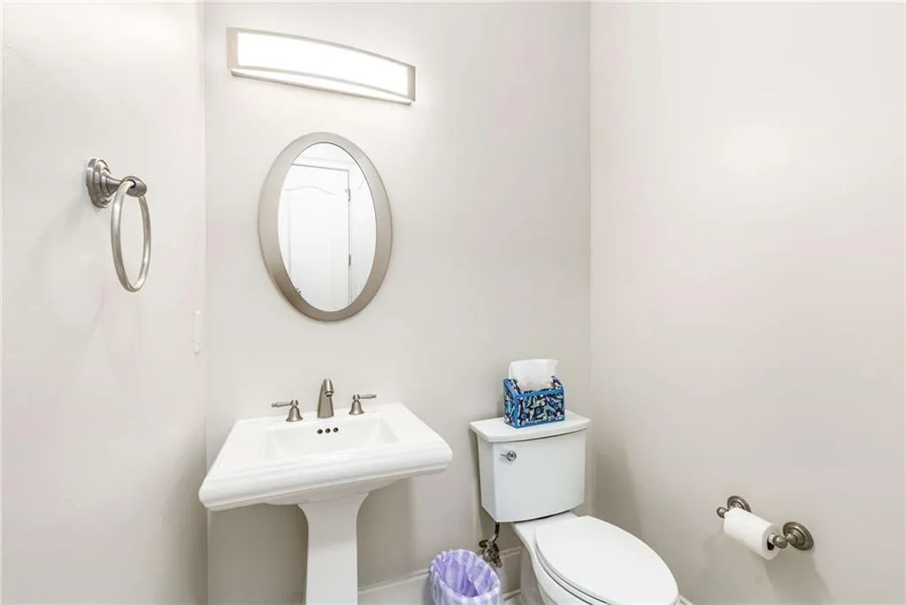 Powder room in the entrance foyer hallway.