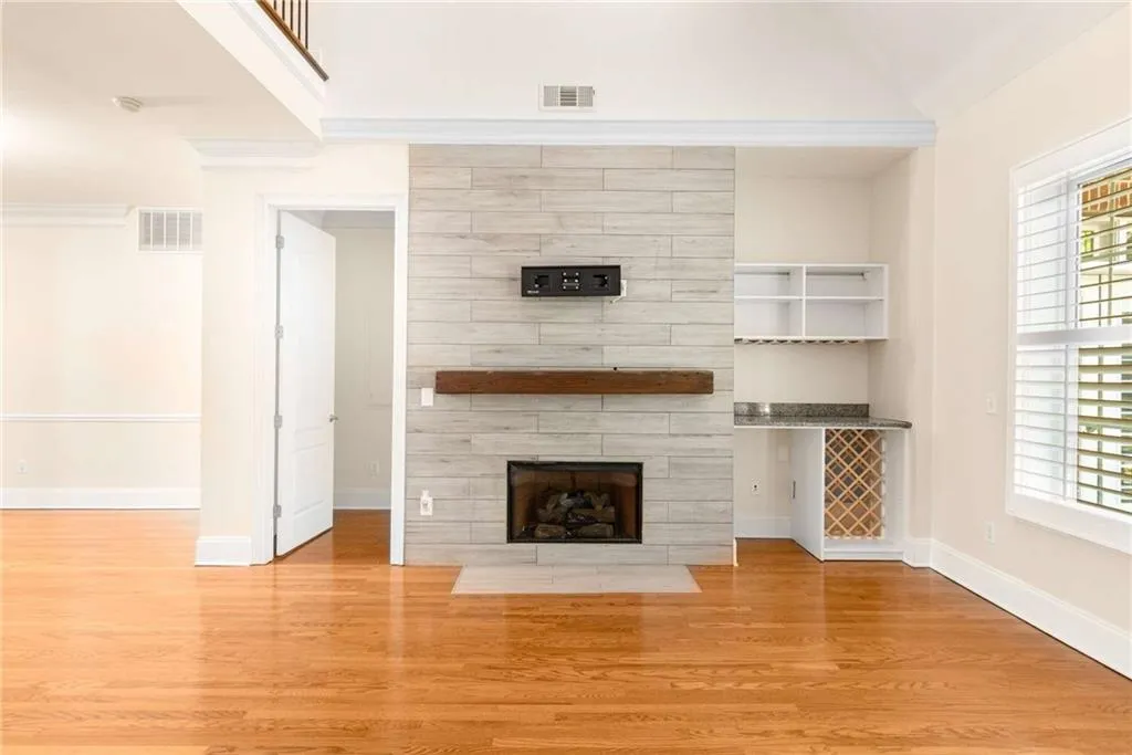 The living room has this custom dry bar which includes wine storage and space for a wine cooler or other small refrigerated storage.
