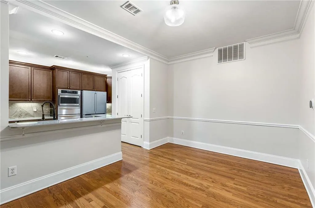 The dining area will accommodate a wide variety of table and furniture arrangements, and the kitchen counter is designed to accommodate bar chairs.