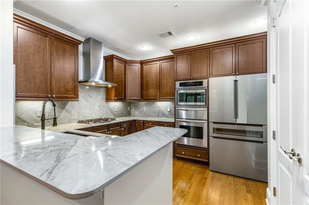The large gorgeous and well organized chef's kitchen has Dekton countertops and backsplash. Dekton is a beautiful, durable, expensive, high quality porcelain which is heat, stain and scratch resistant.  You will love your new countertops!