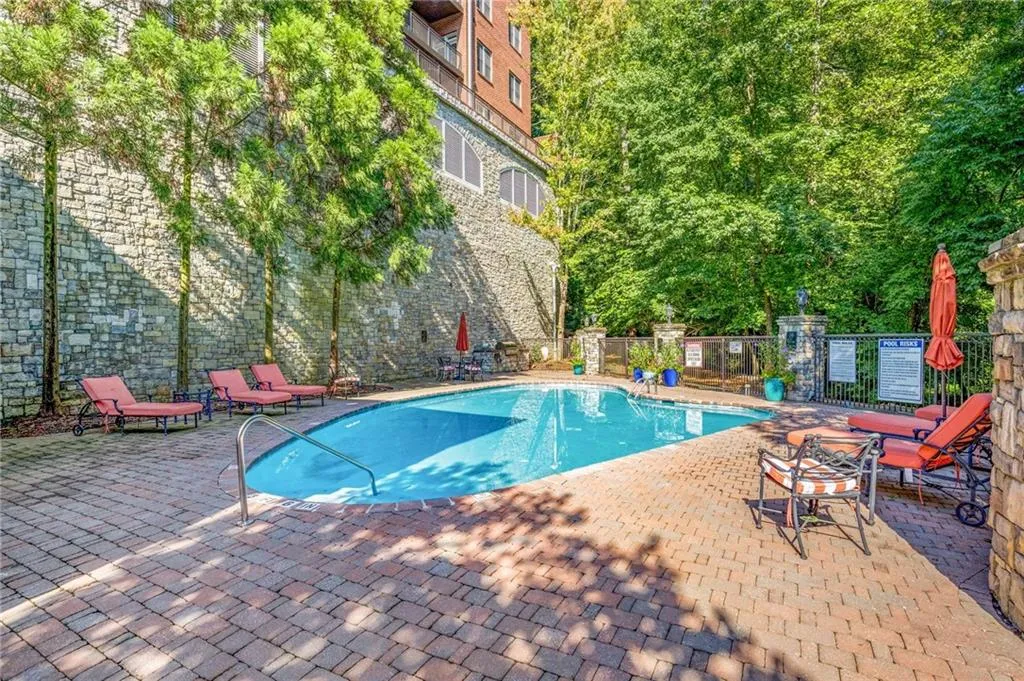 The saltwater pool and deck with tables, chairs and comfy chaise lounges and a grilling area!