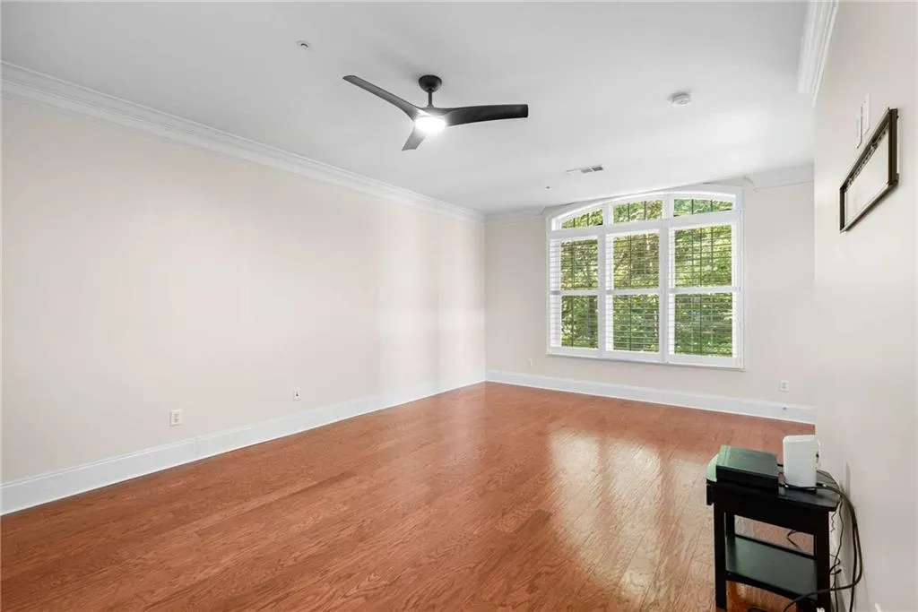 View of the Primary Bedroom from the entry door. The Primary Bedroom Suite occuroie the entire left side of the home.
