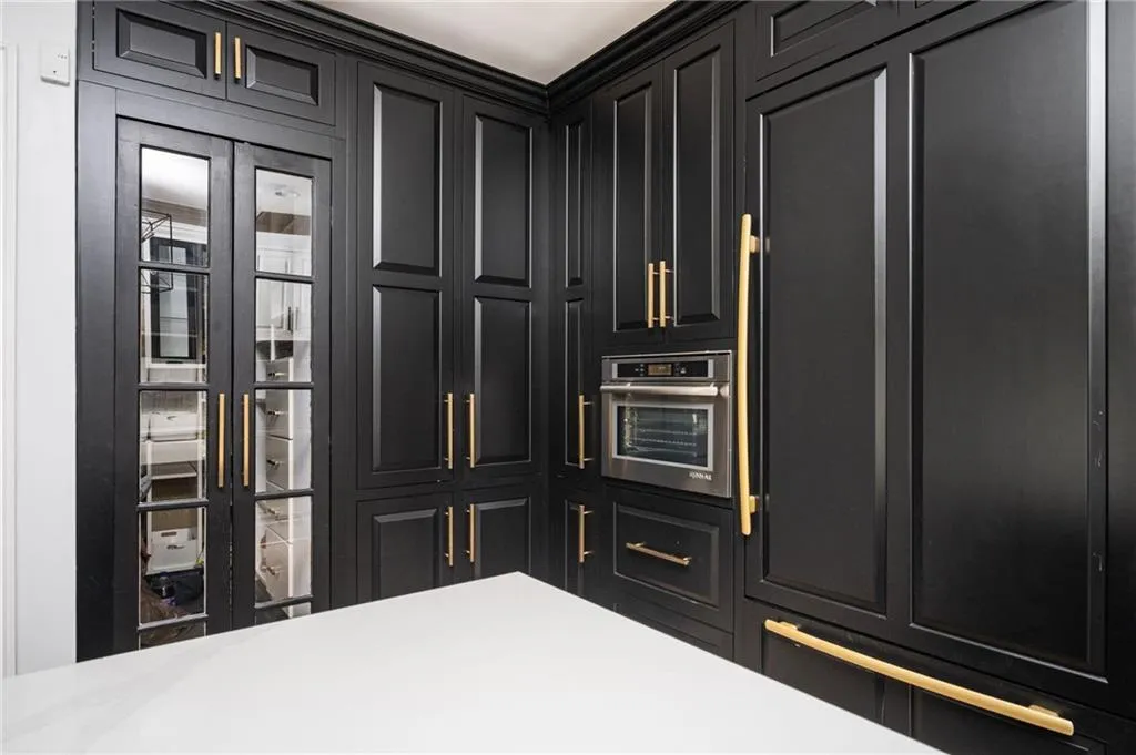 Kitchen featuring stainless steel oven