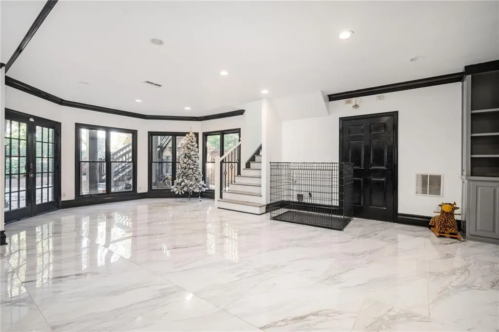 Entryway with ornamental molding, french doors, and a healthy amount of sunlight