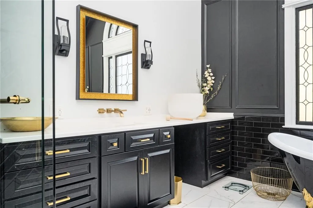 Bathroom featuring vanity and tile walls