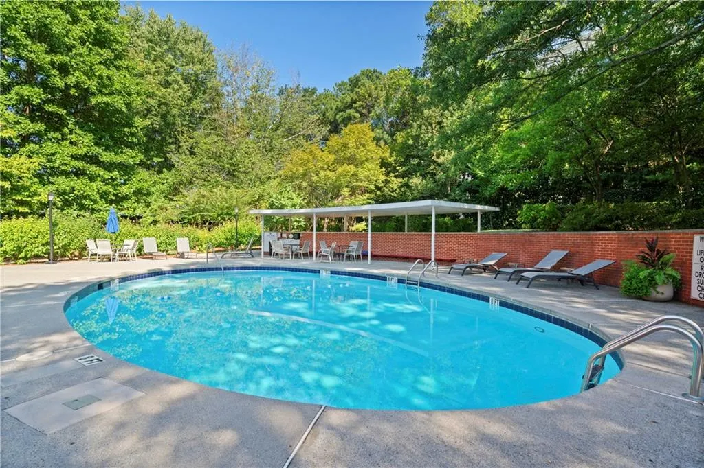 View of swimming pool with a patio