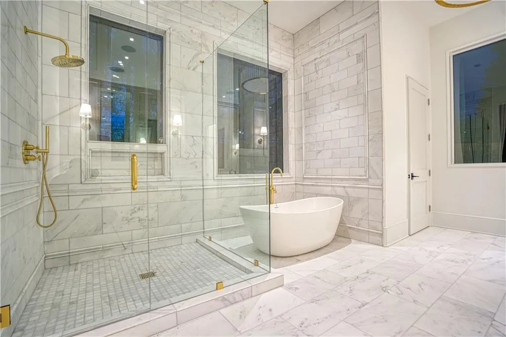 Bathroom with tile walls and separate shower and tub