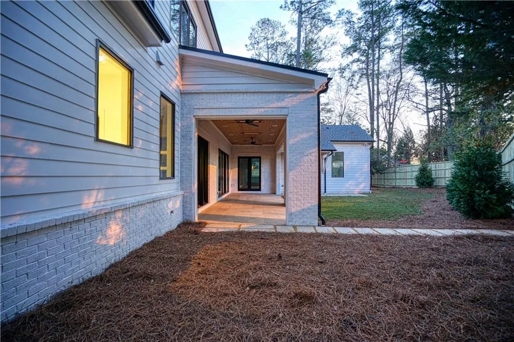 Property entrance with a patio