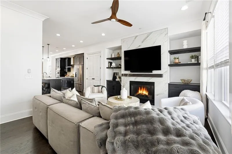 Custom Built Ins were added, along with a Marble Fireplace to the ceiling and Custom Mantle!