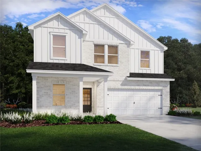 Contemporary two-story residence featuring a white brick and board-and-batten facade, an attached two-car garage, a covered front entry, and a paved driveway