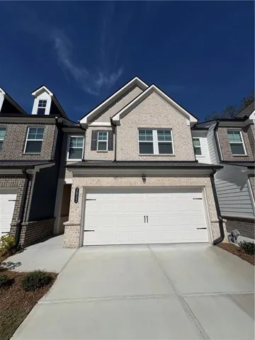 Brick facade with contrasting siding accents