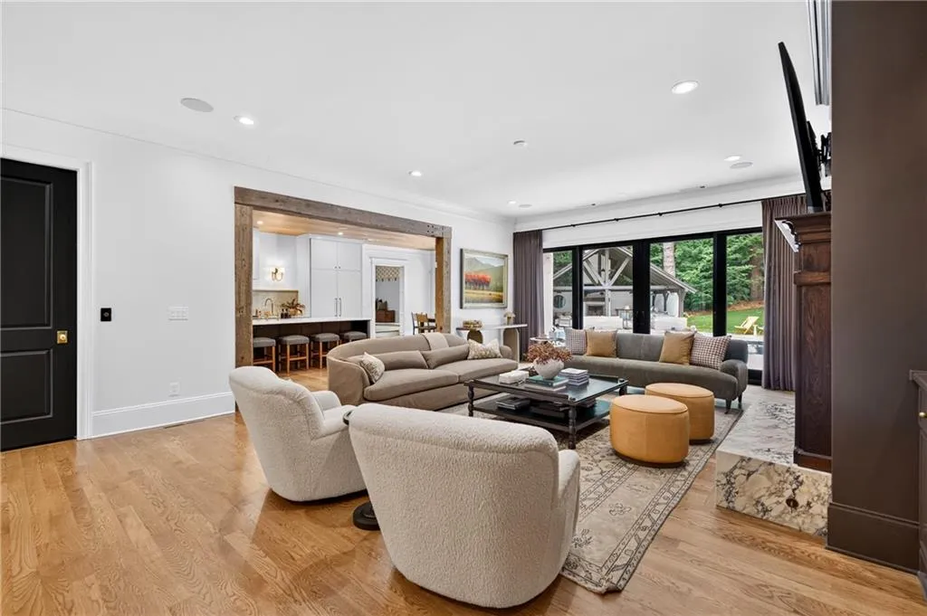 Sliding doors in living room lead to back patio and pool