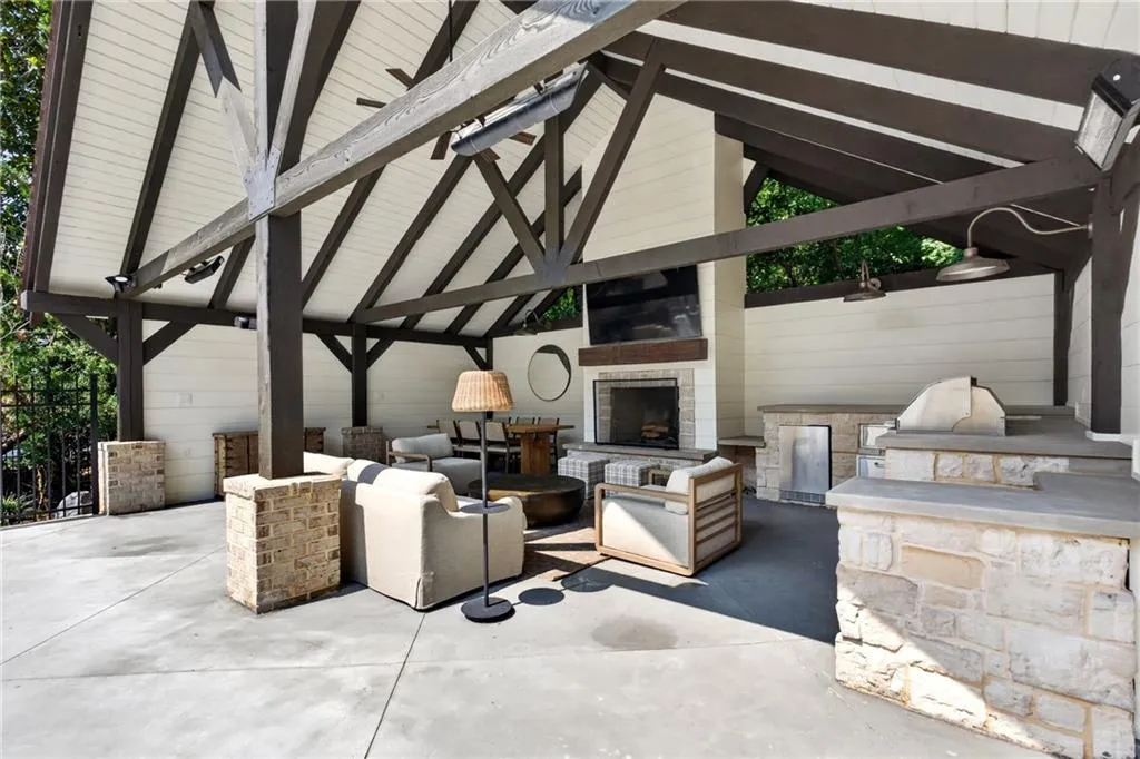 Pool cabana has room for full living and dining area, outdoor fireplace and outdoor grilling kitchen