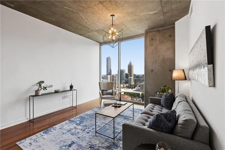 Hardwood-finish flooring complementing exposed concrete ceilings and structural elements