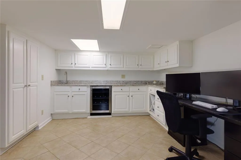 Terrace Level Kitchen with Pantry, Wine Cooler, Wine Storage, Granite Countertops, Tiles Floor.