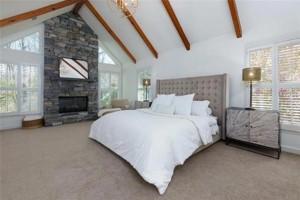 Primary Bedroom - Stone Floor to Ceiling Fireplace