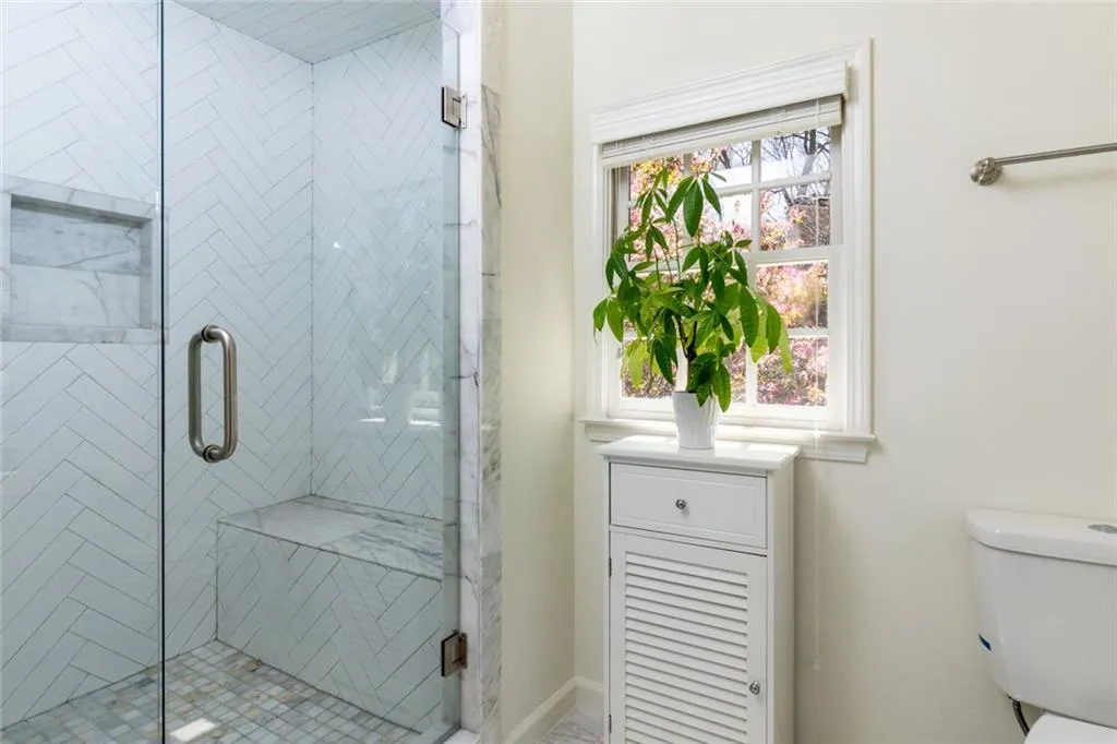 Primary Bathroom with Marble Shower and Marble Seating.