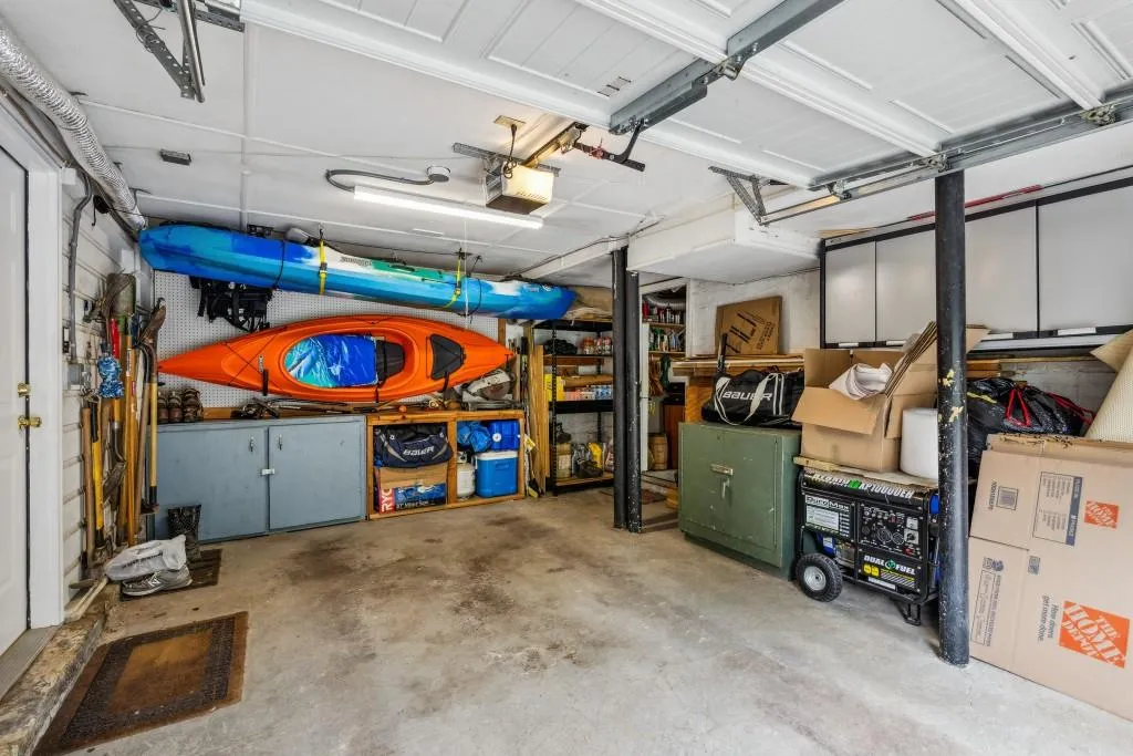 Garage with lots of storage *and* an additional storage room / workshop connected to it.
