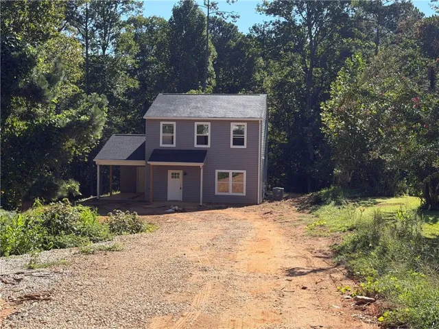 Two-story residence with gray siding and white trim