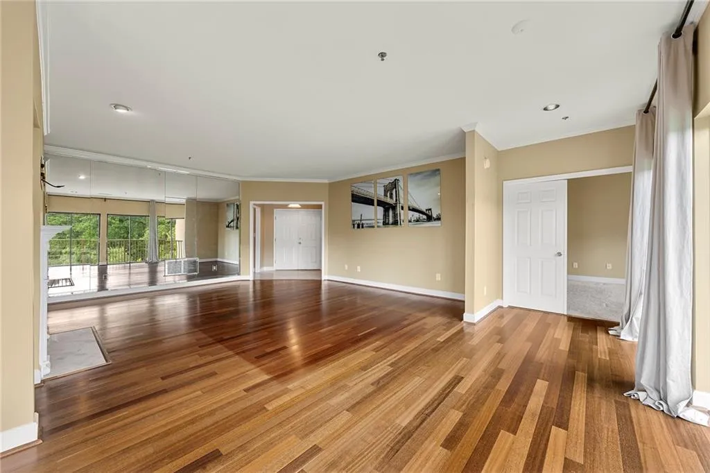 Unfurnished living room featuring ornamental molding, recessed lighting, and light wood-type flooring