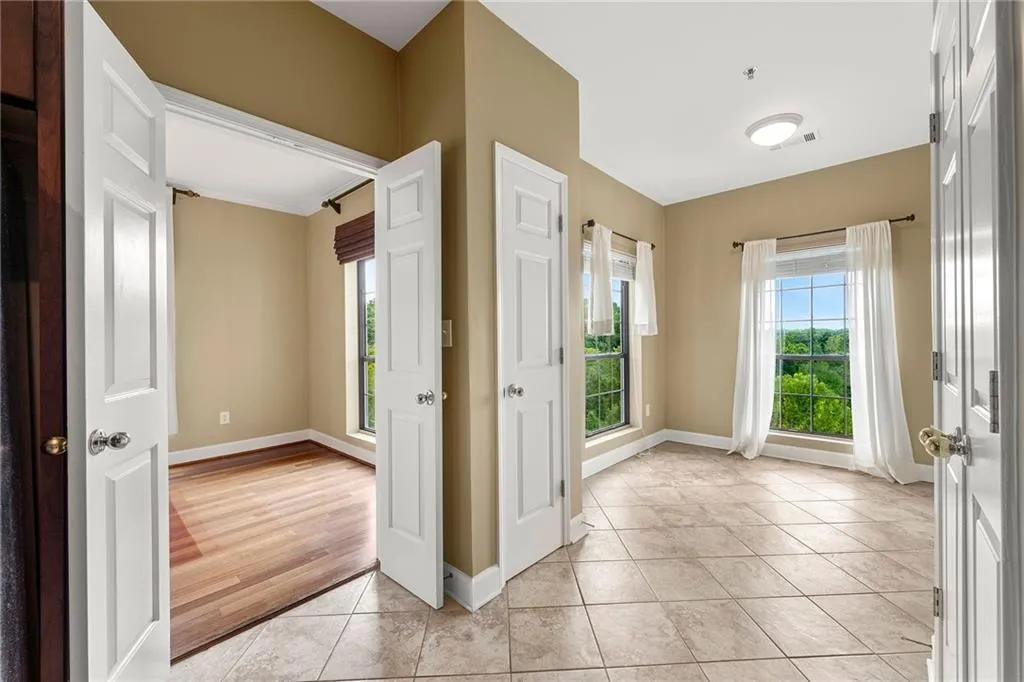 Entrance foyer featuring light tile patterned flooring and baseboards
