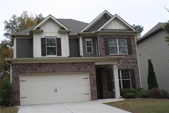 Brick and siding exterior with gabled dormers